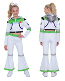 A young girl modeling a Buzz Lightyear-inspired costume set, shown from both the front and back views. The two-piece costume includes a white cropped zip-up jacket with green and blue accents, a silver hood, and matching white flared pants with green and gray trim.